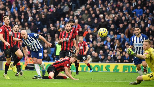 Brighton midfielder Aaron Mooy, No 18, curls home a shot to score against Bournemouth. Picture: AFP