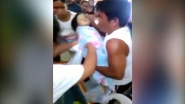 Girl wakes in coffin