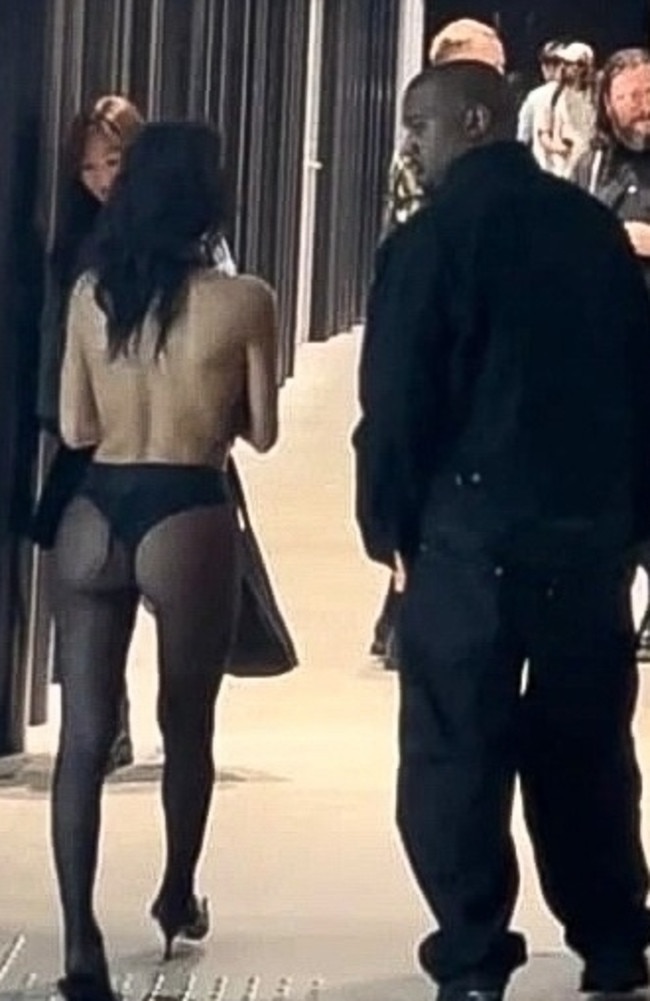 Just an average day out with Kanye and Bianca. While Kanye rugged up for the late night shopping spree, his Australian wife Bianca Censori wore her trademark tights along with a completely backless halter neck top. Picture: Backgrid