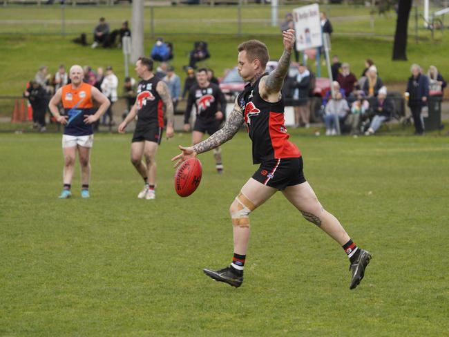 Tyler Black takes a kick for Frankston Dolphins. Picture: Valeriu Campan