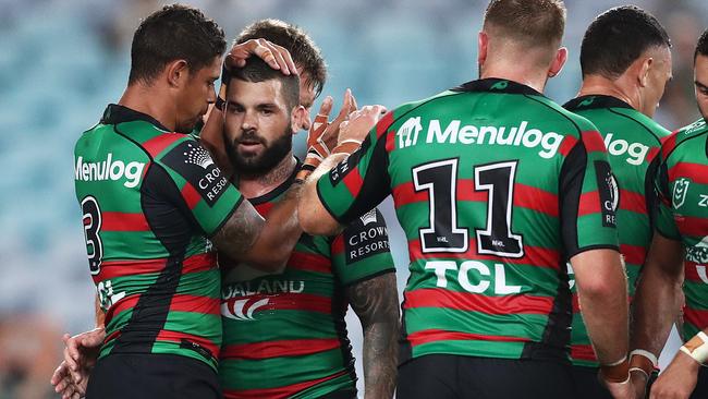 SYDNEY, AUSTRALIA - APRIL 08: Adam Reynolds of the Rabbitohs celebrates scoring a try with team mates during the round five NRL match between the South Sydney Rabbitohs and the Brisbane Broncos at Stadium Australia on April 08, 2021, in Sydney, Australia. (Photo by Mark Metcalfe/Getty Images)