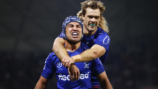 Jahrome Hughes celebrates scoring a try with Ryan Papenhuyzen. Photo by Daniel Pockett/Getty Images.