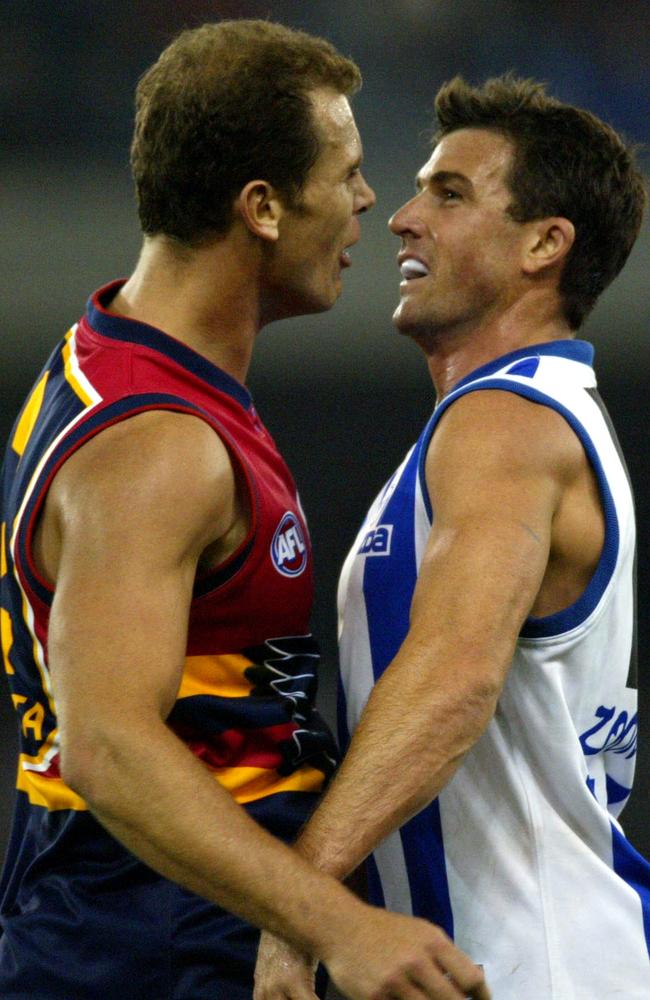 ‘Heart ripped out’ ... Wayne Carey (L) and Anthony Stevens clash on the field after the revelation of the infamous affair.