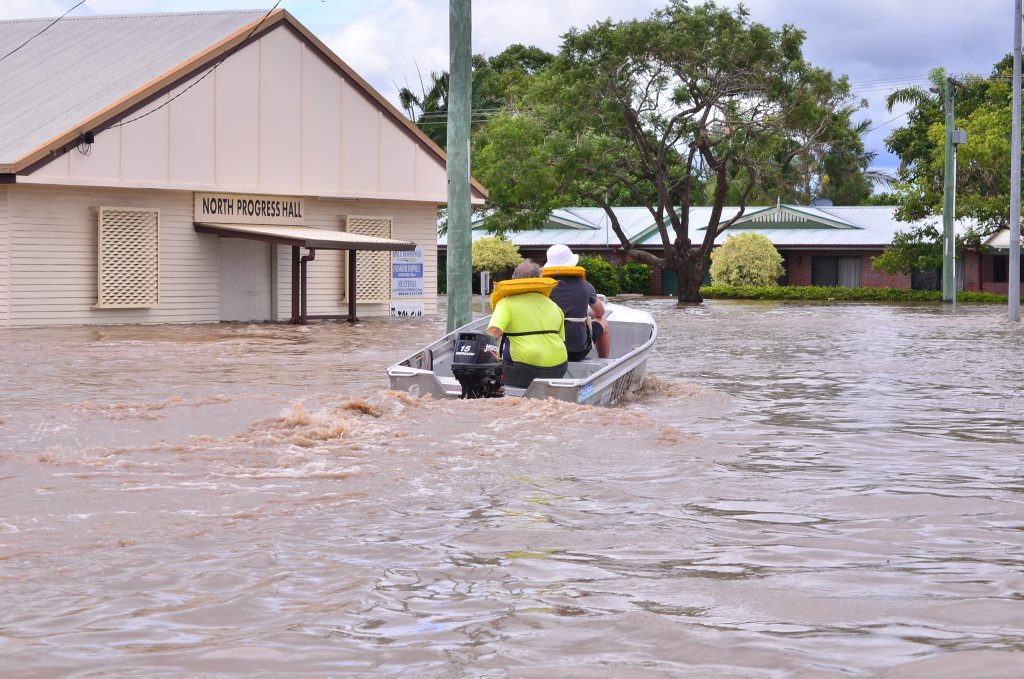 MASS EVACUATION: Emergency services and volunteers work hard and in dangerous waters to evacuate residents of North Bundaberg. Photo: Scottie Simmonds / NewsMail. Picture: Scottie Simmonds