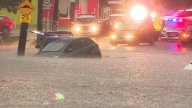 Cars semi-submerged in floodwaters at Colman St, Merrylands after heavy rain. Picture: TNV