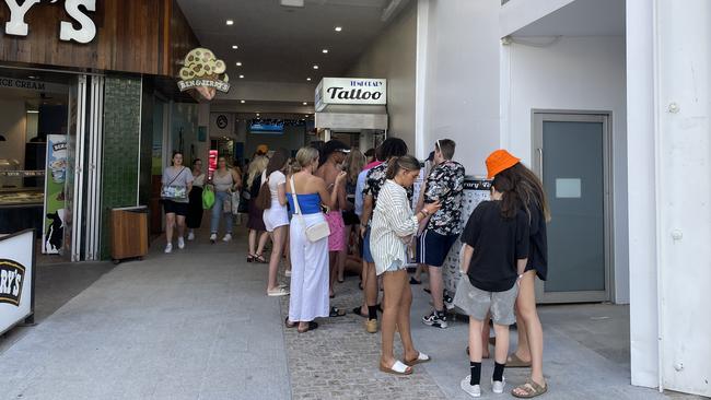 Schoolies queue for airbrush tattoos. Picture: Georgina Noack