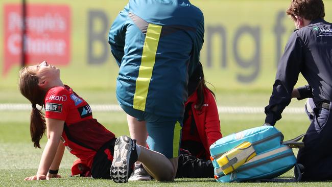 Medical staff with Georgia Wareham after she suffered a knee injury against the Adelaide Strikers. Picture: Sarah Reed/Getty Images