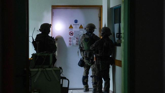 This handout picture released by the Israeli army on November 15 shows Israeli soldiers carrying out operations inside al-Shifa hospital, amid continuing battles betweeen Israel and the Palestinian militant group Hamas.