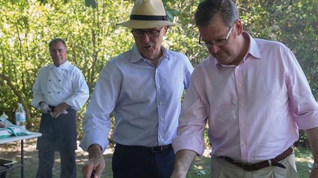 Former prime minister Malcolm Turnbull barbecues meat during a summer party for politicians and their families at The Lodge. Last year’s soiree cost $25,000. Picture: Instagram 