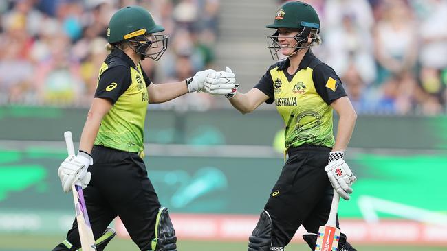 Australian openers Alyssa Healy and Beth Mooney celebrate a boundary. Picture: Michael Klein