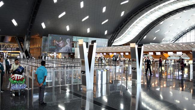 Passengers walk at the Hamad International Airport in Doha. Picture: AFP