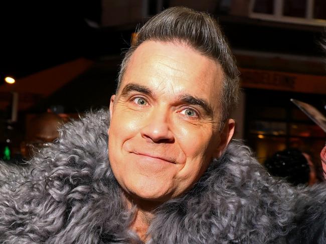 PARIS, FRANCE - DECEMBER 13: Robbie Williams attends the "Better Man" special screening at  on December 13, 2024 in Paris, France. (Photo by Marc Piasecki/Getty Images for Paramount Pictures)