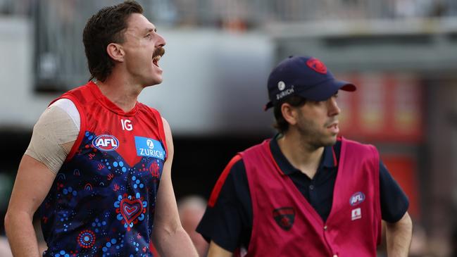 PERTH, AUSTRALIA - MAY 19: Jake Lever of the Demons is assisted off the field under concussion protocols during the 2024 AFL Round 10 match between Waalitj Marawar (West Coast Eagles) and Narrm (Melbourne Demons) at Optus Stadium on May 19, 2024 in Perth, Australia. (Photo by Will Russell/AFL Photos via Getty Images)