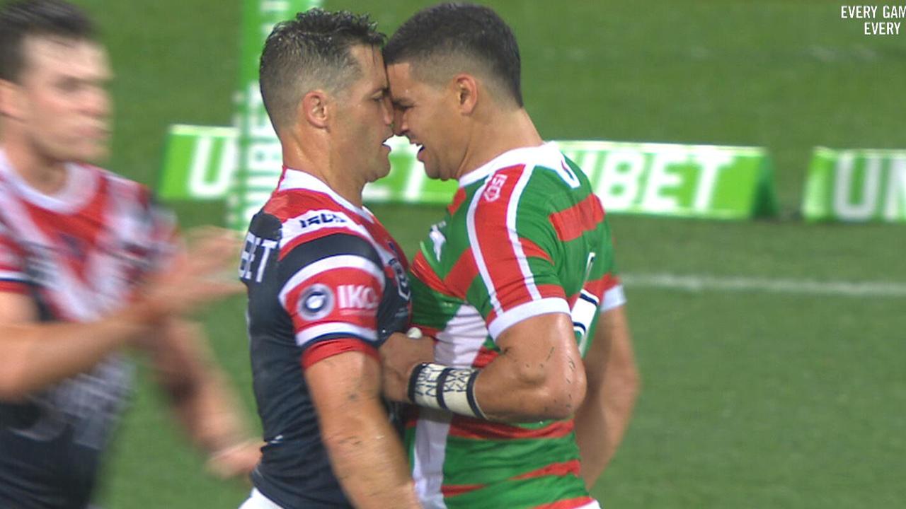 Cody Walker and Cooper Cronk clash in the Roosters v Souths game