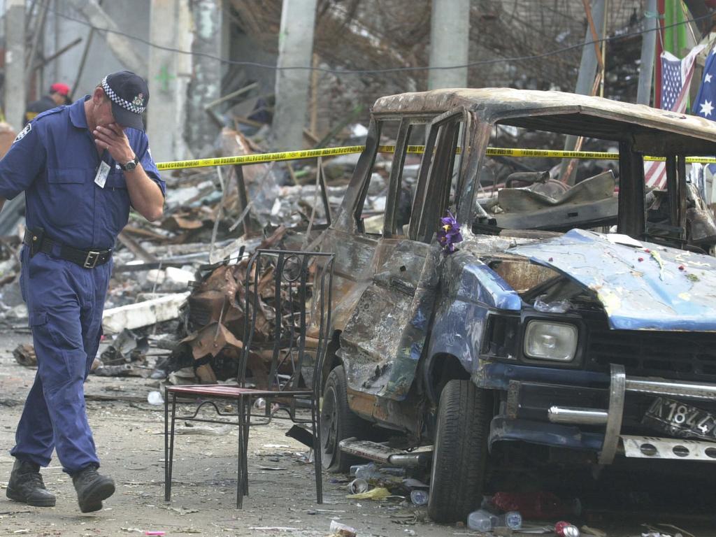 An Australian forensic policeman searches the area near the Sari Club for clues. Picture: Australian Federal Police