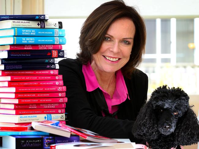 Tasmanian author Ris Wilkinson (Melanie Milburne) is about to have her 50th Mills & Boon novel published. Ris with Lilly one of her poodles and some of her 50 titles. Book number 50, and Maelanie's Tiffany pin sent from the publishers to celebrate.