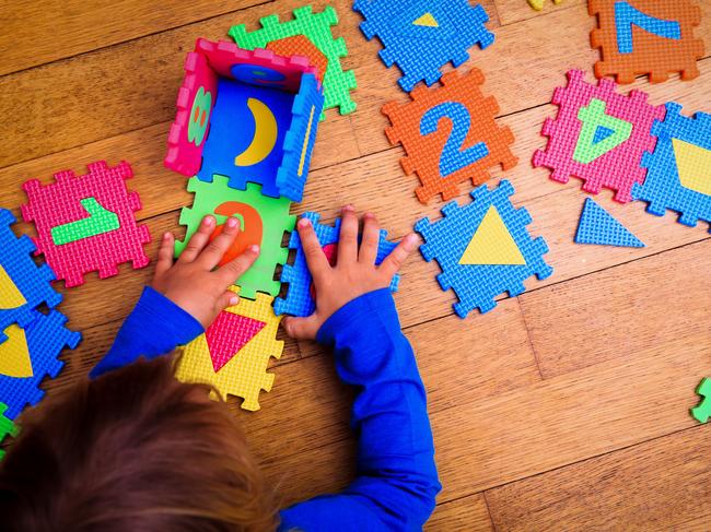 little girl playing with puzzle, early education and learning