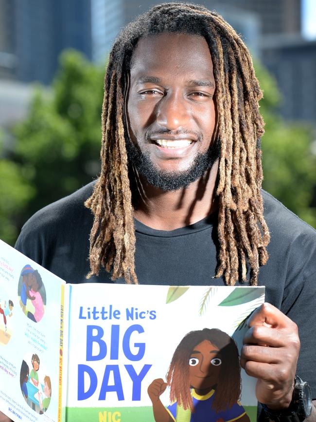 Nic Naitanui with his book, ‘Little Nic’s Big Day’. Picture: Andrew Henshaw