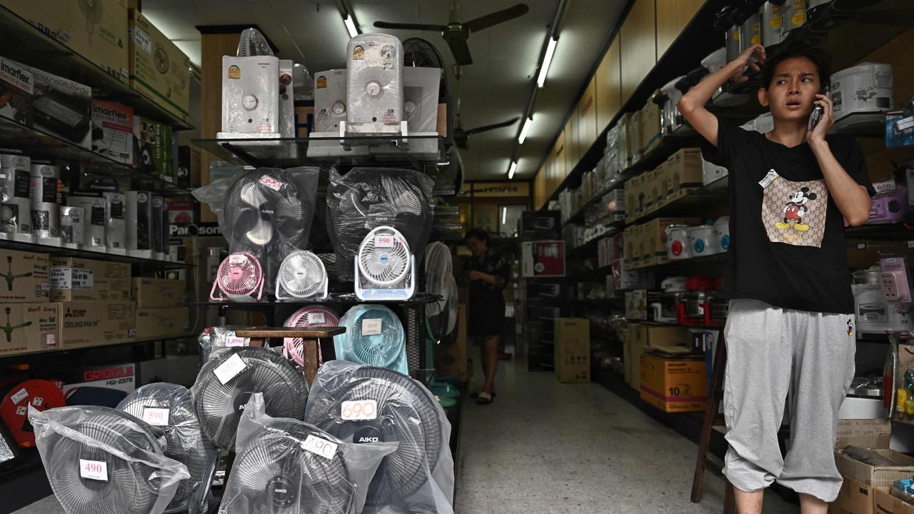 People across South and Southeast Asia have been taking cover beneath any shelter they can find as they pray for cooling rains with record temperatures hitting the region. Picture: Lillian Suwanrumpha /AFP