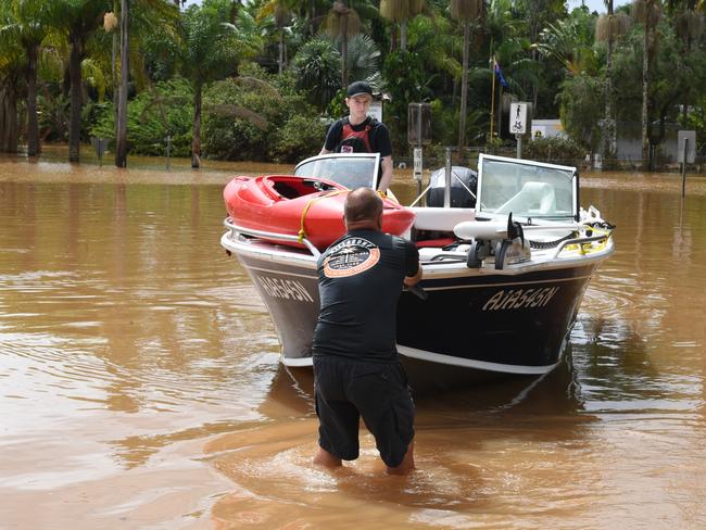 Volunteers preparing to take medicines and supplied to residents during the floods. Picture: Cath Piltz