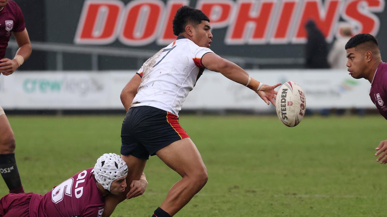 Dolphins signing Isaiya Katoa offloads the ball for NSW CIS in their semi-final against Queensland. Picture: Liam Kidston