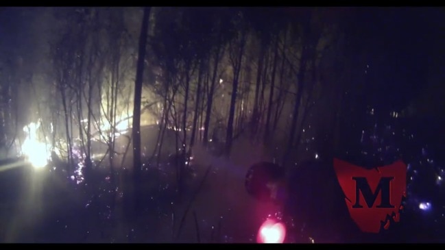 Geeveston firefighters in action battling a spot fire. Vision: TOM SHEPPERD/GEEVESTON FIRE BRIGADE