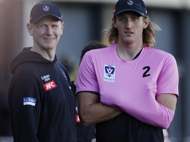 Nathan Murphy (right) on the sidelines during a Magpies intraclub match. Picture: Michael Klein