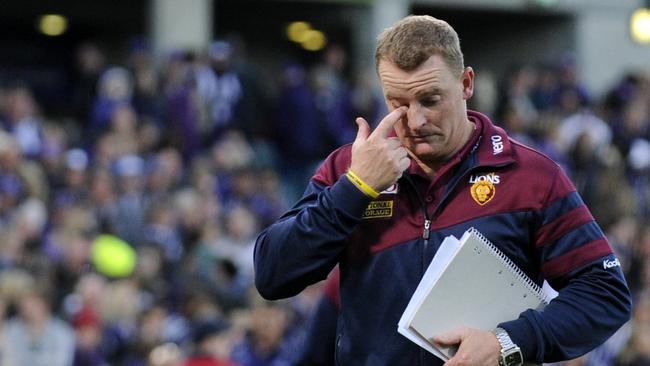 Michael Voss leaves the field after a loss during his stint as Brisbane Lions senior coach.