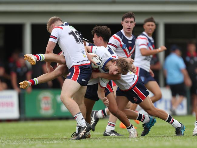 Aidan Wunsch is tackled by Alexander Stephenson. Johns Cup Central Coast Roosters v Monaro Colts Round One at Morry Breen Oval Central Coast Saturday 3rd February. pic Sue Graham