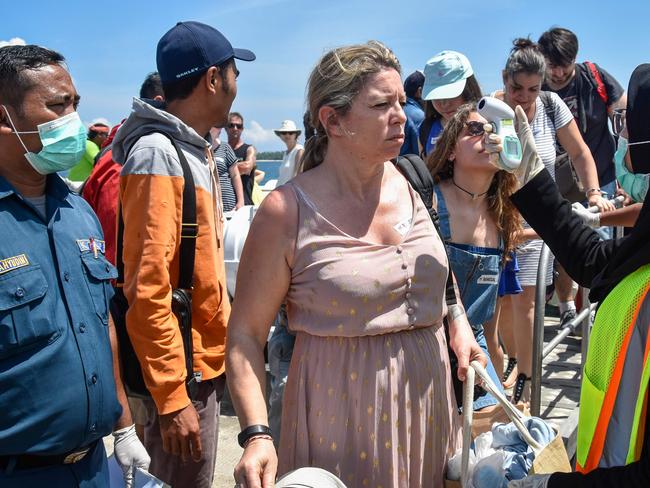 Indonesian health officials checking body temperatures of tourists arriving from Bali island and heading to tourist area Gili Trawanganin Pemenang Lombok during February. Picture: Moh El Sasaky/AFP