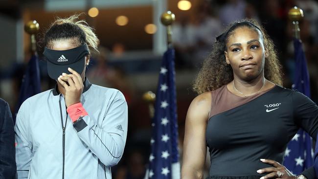 Tennis player Serena Williams competes in the women's singles finals at the 2018 U.S. Open in Flushing NY on September 8, 2018. Naomi Osaka defeated Serena Williams. 08 Sep 2018 Pictured: (L-R) Tennis players Naomi Osaka hides her face while standing next to Serena Williams during the trophy presentation ceremony at the 2018 U.S. Open in Flushing NY on September 8, 2018. (Photo by Andrew Schwartz)//SCHWARTZANDREW_TENNIS0022/Credit:Andrew Schwartz/SIPA/1809091205. Photo credit: Andrew Schwartz/SIPA / MEGA TheMegaAgency.com +1 888 505 6342