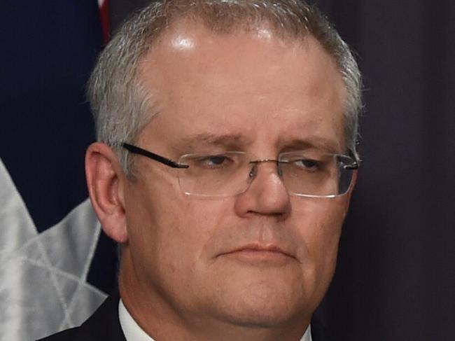 Australia's Treasurer Scott Morrison and Australia's Finance Minister Mathias Cormann speak to the media during a press conference at Parliament House in Canberra, Monday, Dec. 19, 2016. Australia's Treasurer Scott Morrison will hand down the Mid Year Economic and Fiscal Outlook (MYEFO). (AAP Image/Lukas Coch) NO ARCHIVING