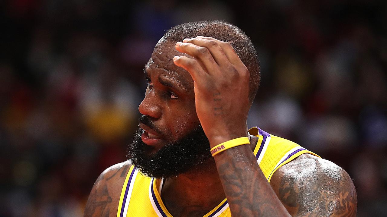 HOUSTON, TEXAS - MARCH 09: LeBron James #6 of the Los Angeles Lakers hold his head after he was hit going to the basket against the Houston Rockets during the fourth quarter at Toyota Center on March 09, 2022 in Houston, Texas. NOTE TO USER: User expressly acknowledges and agrees that, by downloading and or using this photograph, User is consenting to the terms and conditions of the Getty Images License Agreement. (Photo by Bob Levey/Getty Images)