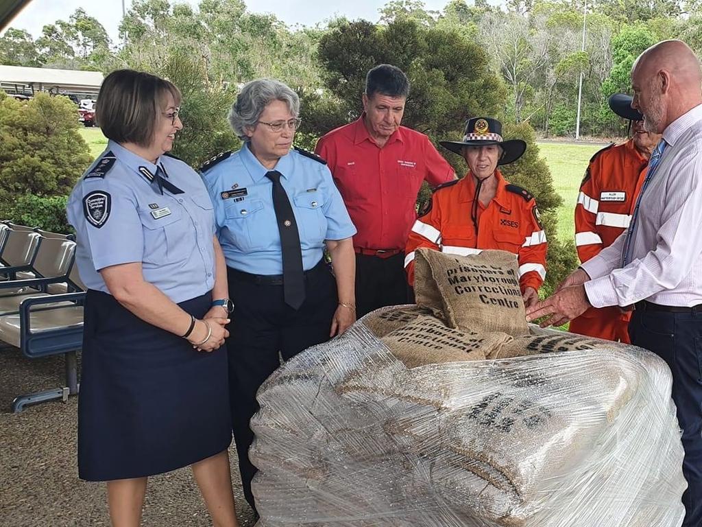 Maryborough MP Bruce Saunders with the sandbags made by prisoners at the city's jail.