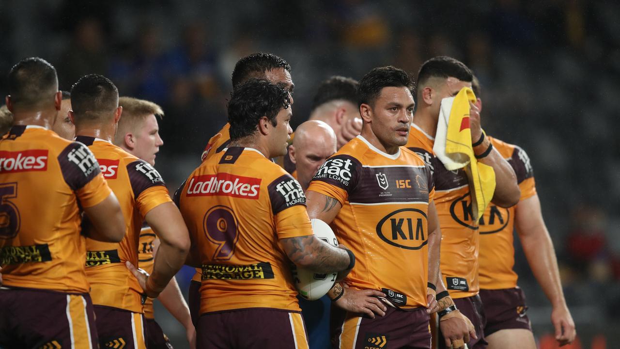 Broncos players digest their loss to the Eels.