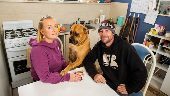 Travis Gregory-Phillipps and Amy Cracknell with dog Ruby are living in a granny flat in the former Darlington police station at a car yard. <a href="https://www.adelaidenow.com.au/news/south-australia/south-australias-rental-crisis-couple-went-from-seaside-house-to-adelaide-car-yard/news-story/00ae1cf95ed16c69b623b9e2cfec5dc8" title="www.adelaidenow.com.au">Read their story</a>Picture: Tom Huntley