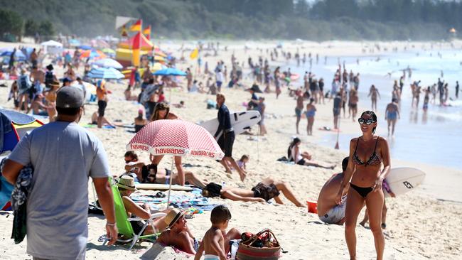 Beachgoers at Burleigh Heads on a glorious Gold Coast day. Picture: Adam Head