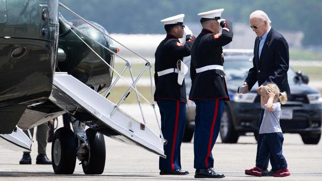 Joe Biden boards Marine One with grandson Beau Biden at Andrews Air Force Base in Maryland at the weekend. Picture: AFP