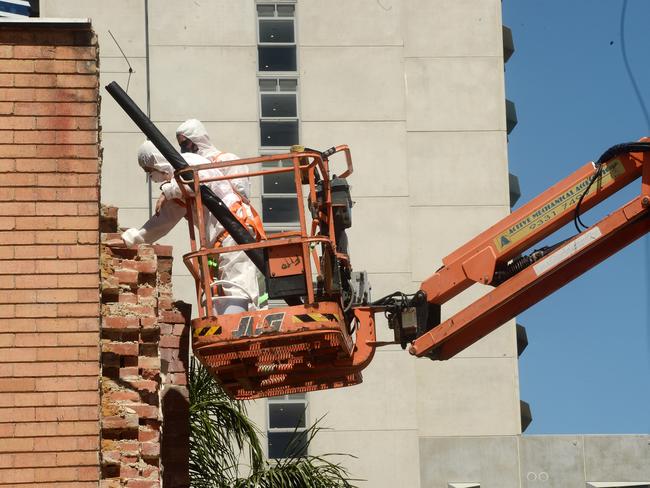 Workers at the Corkman Irish Pub site after it was demolished. Picture: Rob Leeson