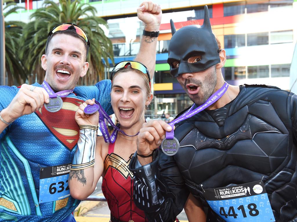 Maybe a superhero costume makes you run faster? But it sure would be hot! From left, Lucas Edward, Georgina Musk and Matthew Gigannakis all finished their Run for the Kids. Picture: Josie Hayden