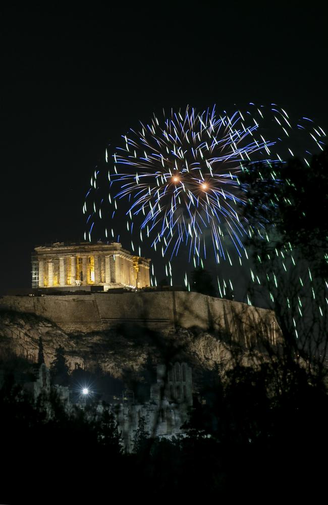 Fireworks explode over the ancient Parthenon temple at the Acropolis hill during the New Year's Eve celebrations in Athens. Picture: AP