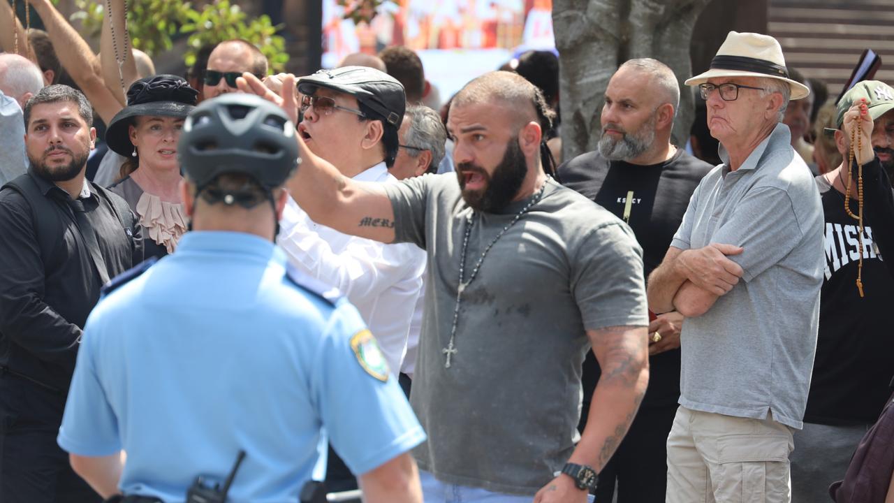 This mourner became enraged by the sign. Picture: Nicholas Eagar