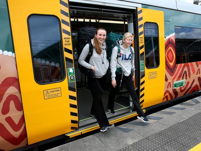 Lisa Ottander, 20, and Olivia Lindstrom, 19, both from Sweden, hop off one of Queensland’s New Generation Rollingstock trains at Brisbane Airport. Picture: Liam Kidston