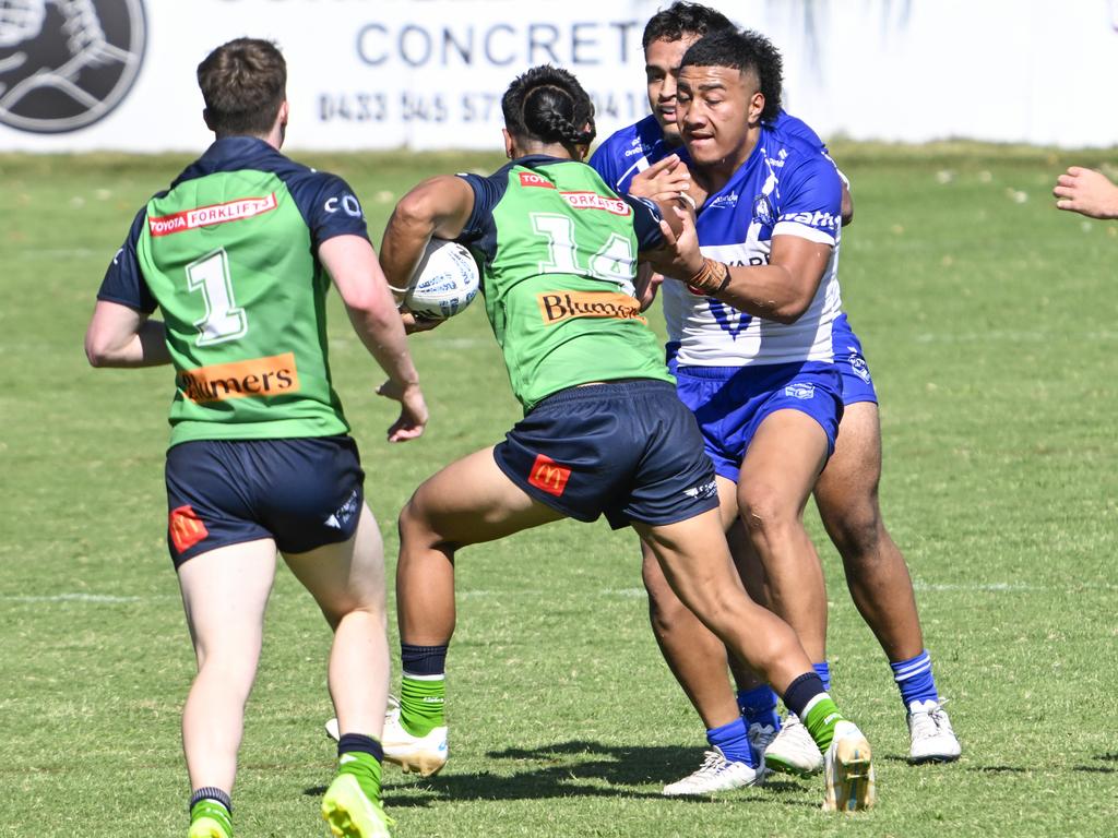 Ezra Leota tries to get past Sosaia Alatini. Picture: Martin Ollman