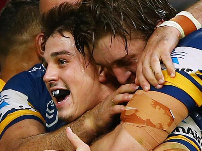 SYDNEY, AUSTRALIA - APRIL 22: Reed Mahoney of the Eels celebrates with team mates after scoring a try during the round 6 NRL match between the Parramatta Eels and Wests Tigers at Bankwest Stadium on April 22, 2019 in Sydney, Australia. (Photo by Matt Blyth/Getty Images)