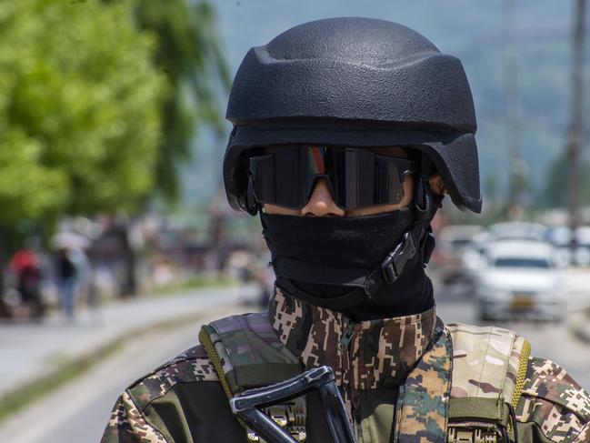 SRINAGAR, INDIA - APRIL 26: An Indian paramilitary soldier stands guard on the bank of Dal lake, amid heightened tensions following a deadly attack in Pahalgam that killed 26 tourists, on April 26, 2025 in Srinagar, India. Kashmir experiencing a period of increased tension and uncertainty after the killing of 26 Indian tourists in Baisaran Valley, the worst civilian attack in nearly two decades. A large number of security personnel have been deployed across the region, dominating daily life. The violence has shattered the image of normalcy officials tried to build through booming tourism. Tensions between India and Pakistan have spiked, with fear and uncertainty gripping the region. India blames Pakistani militant groups for the attack, while Pakistan denies any role. Prime Minister Narendra Modi's vow to pursue the attackers has led to mass detentions in Kashmir. India withdrew from the Indus Waters Treaty, prompting Pakistan to close its airspace. Relations between the nuclear-armed rivals have sunk to a new low. (Photo by Yawar Nazir/Getty Images)
