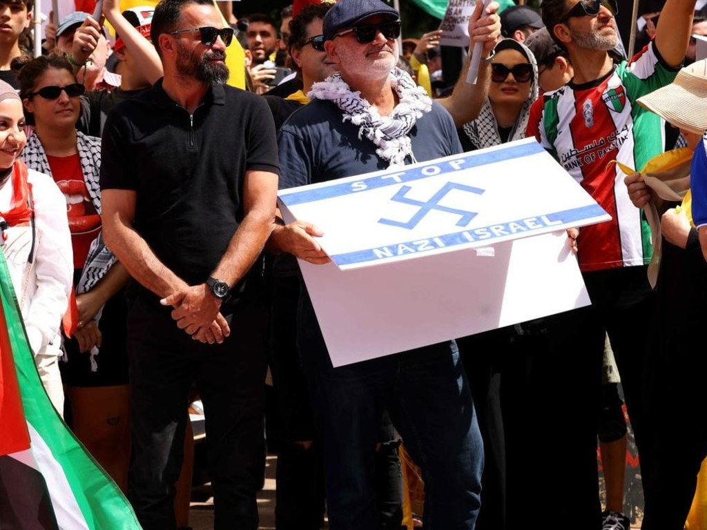 Al Yazbek held up a sign with a swastika. Picture: NewsWire / Damian Shaw