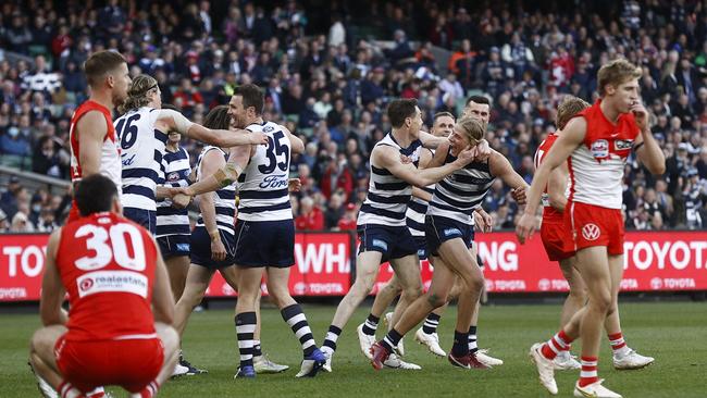 Cats players celebrate a late goal. Picture: Darrian Traynor/AFL Photos/via Getty Images