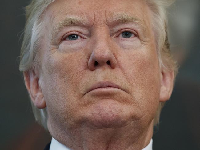 President Donald Trump listens as he is introduced to speak with winners from the National Minority Enterprise Development Week Awards Program, in the Oval Office of the White House, Tuesday, Oct. 24, 2017, in Washington. (AP Photo/Evan Vucci)