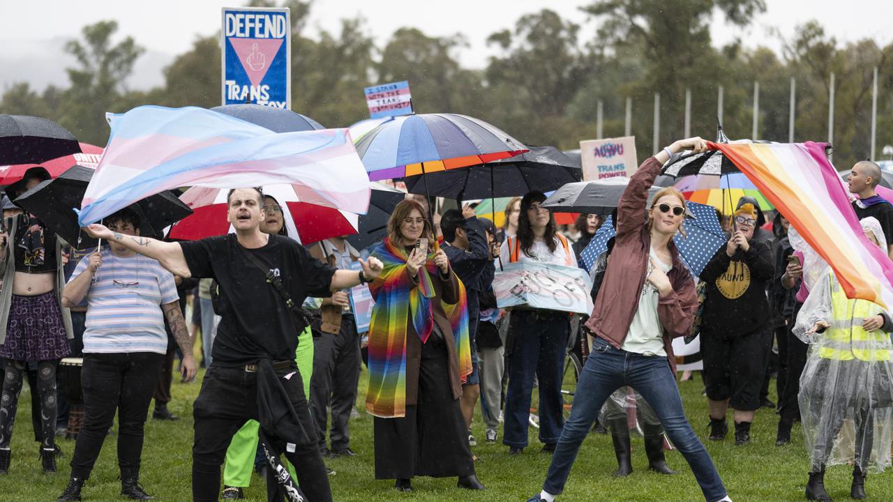 More than a hundred trans-rights activists braved the rain to show their support. Picture: NCA NewsWire / Martin Ollman